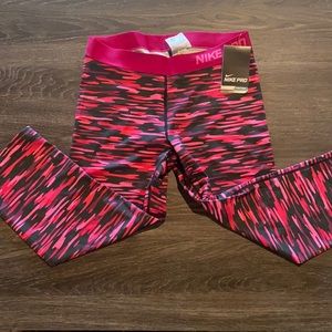 Nike pink multi-colored 3/4 length yoga pants, size large.